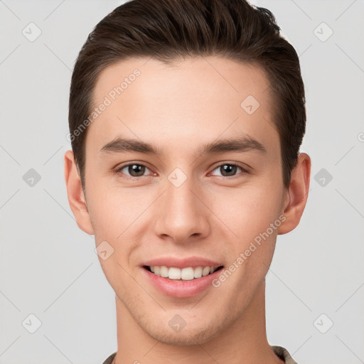 Joyful white young-adult male with short  brown hair and brown eyes