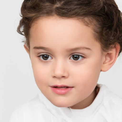 Joyful white child female with short  brown hair and brown eyes