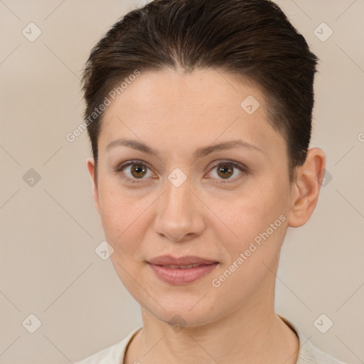 Joyful white young-adult female with short  brown hair and brown eyes