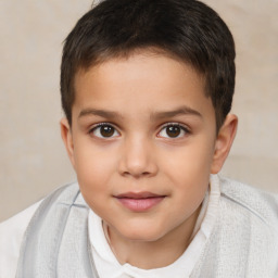 Joyful white child male with short  brown hair and brown eyes