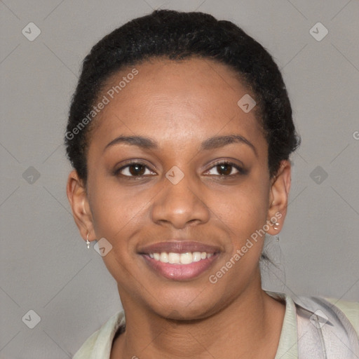 Joyful black young-adult female with short  black hair and brown eyes