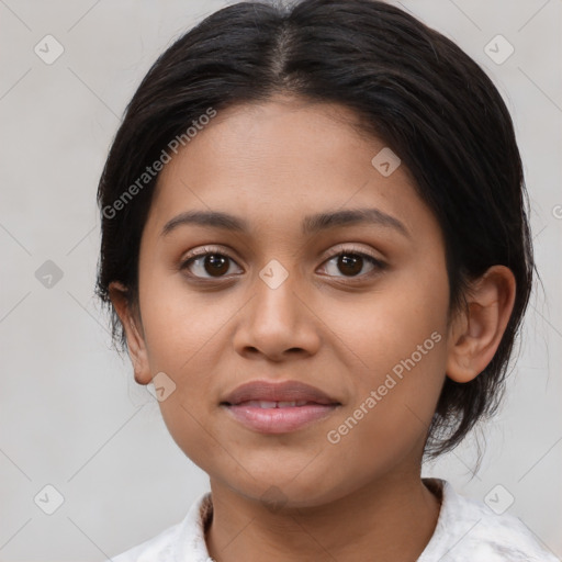 Joyful latino young-adult female with medium  brown hair and brown eyes