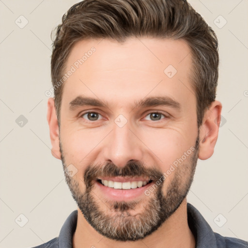 Joyful white adult male with short  brown hair and brown eyes