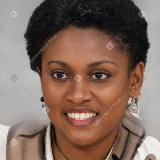 Joyful black young-adult female with short  brown hair and brown eyes