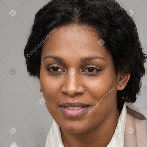 Joyful black adult female with short  brown hair and brown eyes