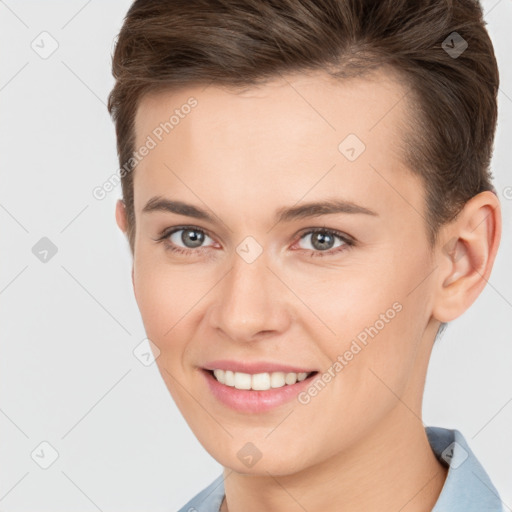 Joyful white young-adult female with short  brown hair and brown eyes