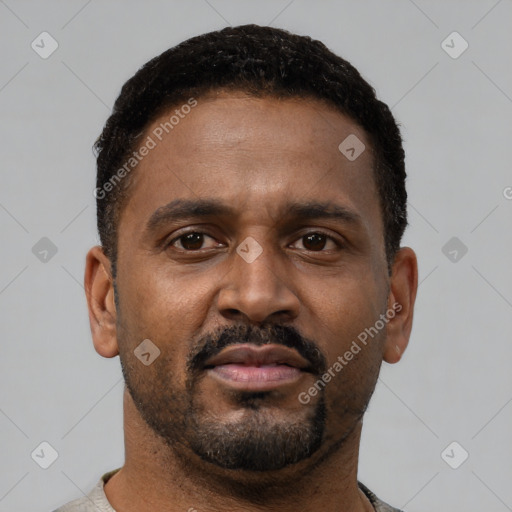 Neutral latino young-adult male with short  brown hair and brown eyes
