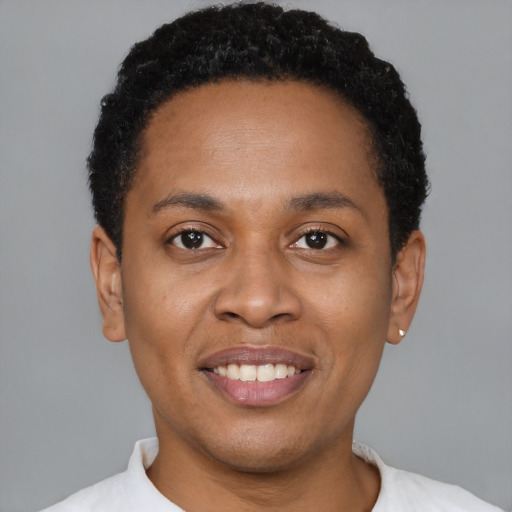 Joyful latino young-adult female with short  black hair and brown eyes