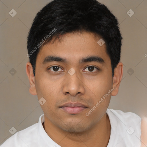 Neutral latino young-adult male with short  black hair and brown eyes