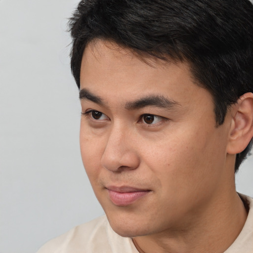 Neutral white young-adult male with short  black hair and brown eyes