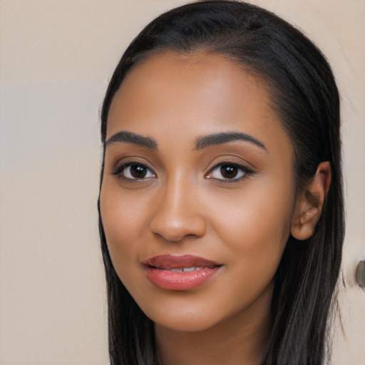 Joyful latino young-adult female with long  black hair and brown eyes