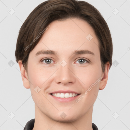 Joyful white young-adult female with short  brown hair and grey eyes