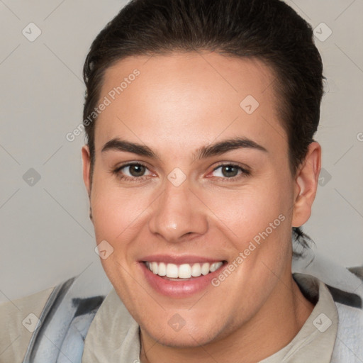 Joyful white young-adult female with short  brown hair and brown eyes