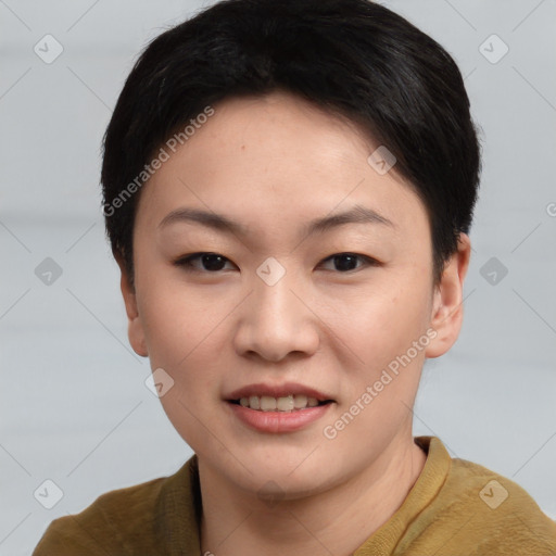 Joyful asian young-adult female with short  brown hair and brown eyes