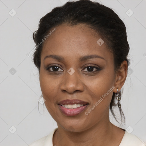 Joyful black young-adult female with medium  brown hair and brown eyes