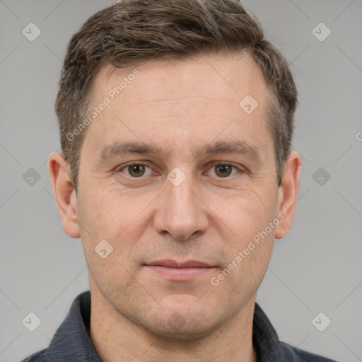 Joyful white adult male with short  brown hair and grey eyes