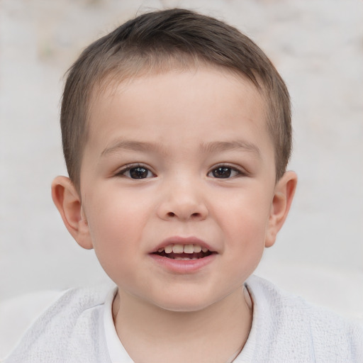 Joyful white child male with short  brown hair and brown eyes