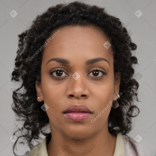 Neutral black young-adult female with long  brown hair and brown eyes