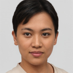 Joyful asian young-adult female with short  brown hair and brown eyes