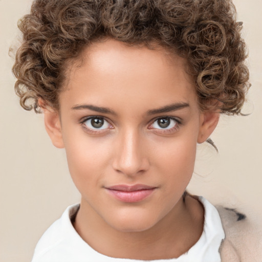 Joyful white child female with short  brown hair and brown eyes