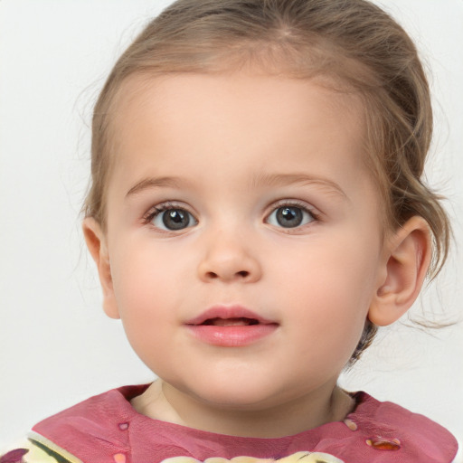 Joyful white child female with medium  brown hair and blue eyes