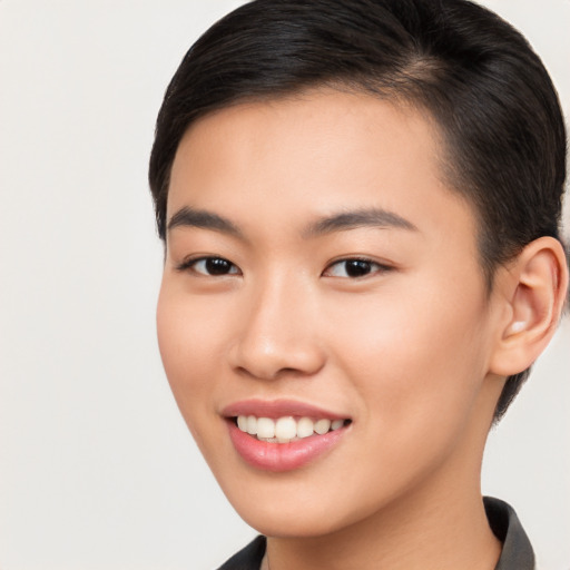 Joyful asian young-adult female with short  brown hair and brown eyes