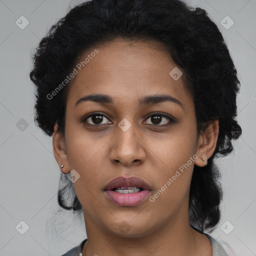 Joyful latino young-adult female with short  black hair and brown eyes