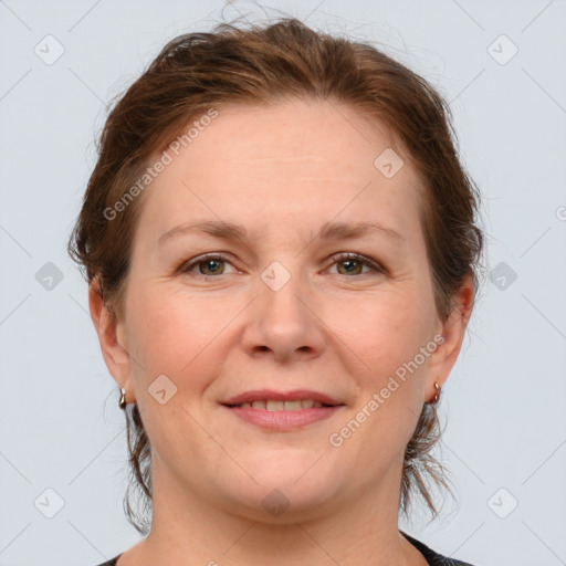 Joyful white adult female with medium  brown hair and grey eyes