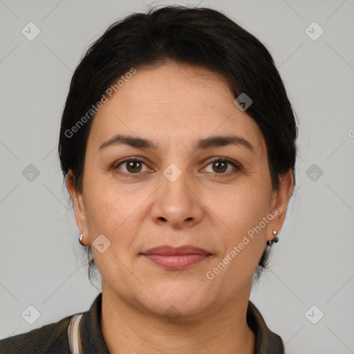 Joyful white adult female with short  brown hair and brown eyes