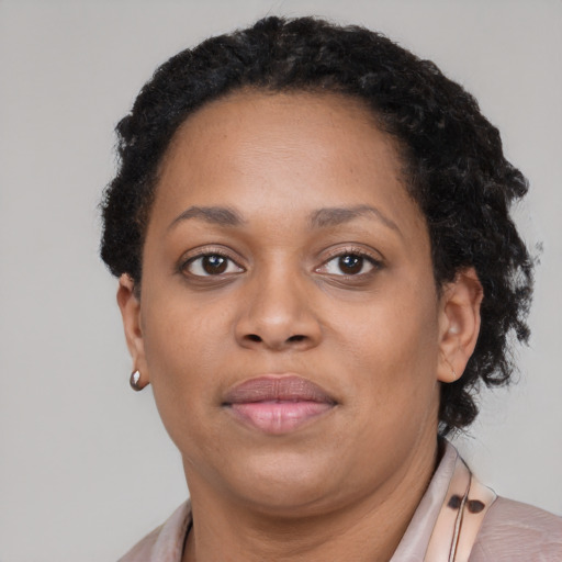 Neutral black adult female with short  brown hair and brown eyes