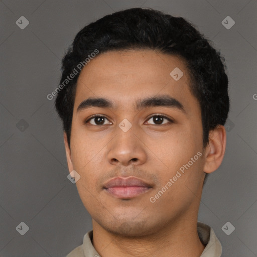 Neutral latino young-adult male with short  black hair and brown eyes