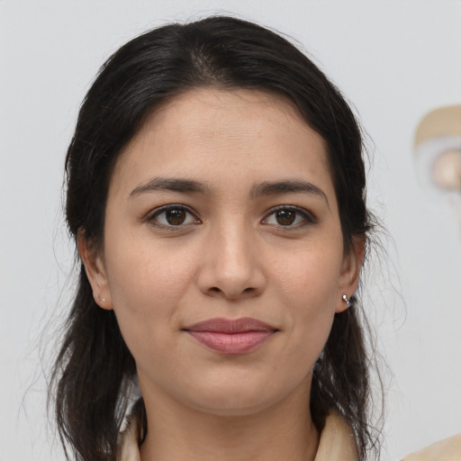 Joyful white young-adult female with medium  brown hair and brown eyes