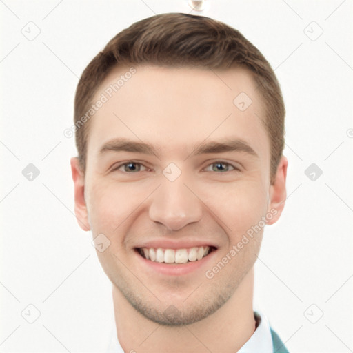 Joyful white young-adult male with short  brown hair and grey eyes