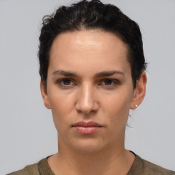 Neutral white young-adult female with short  brown hair and brown eyes