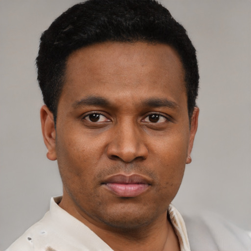 Neutral latino young-adult male with short  black hair and brown eyes