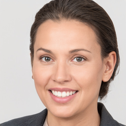 Joyful white young-adult female with medium  brown hair and brown eyes