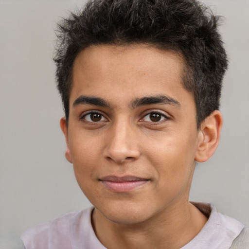 Joyful latino young-adult male with short  brown hair and brown eyes