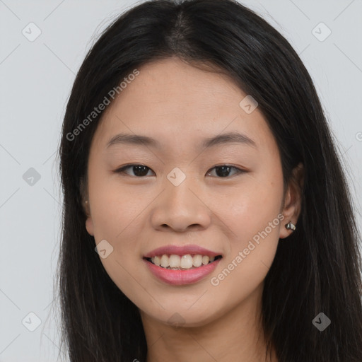 Joyful asian young-adult female with long  brown hair and brown eyes