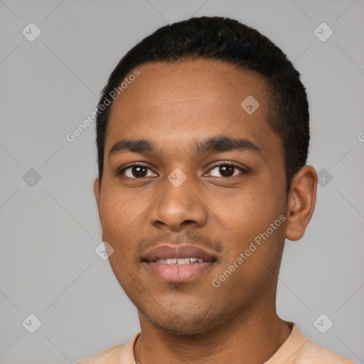 Joyful black young-adult male with short  black hair and brown eyes