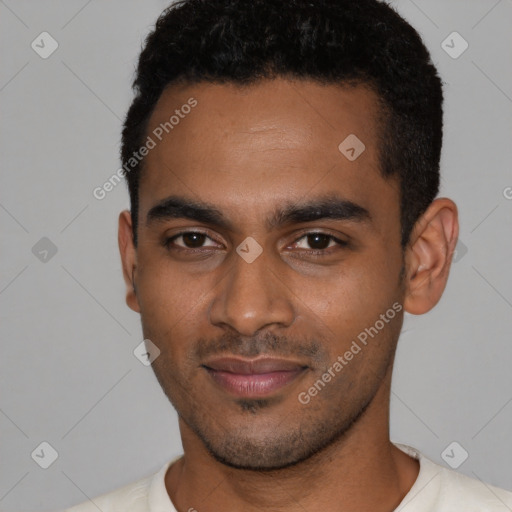 Joyful black young-adult male with short  black hair and brown eyes