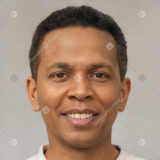 Joyful latino young-adult male with short  brown hair and brown eyes