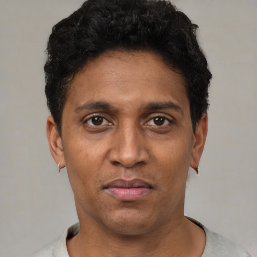 Neutral black adult male with short  black hair and brown eyes