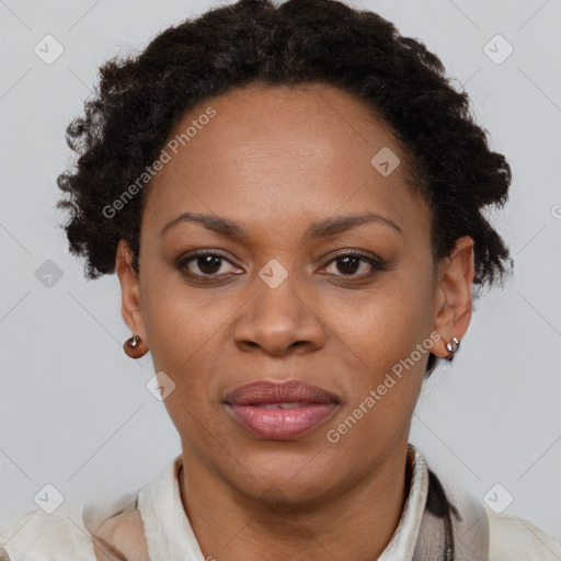 Joyful black adult female with short  brown hair and brown eyes