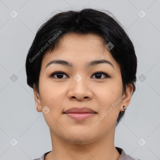 Joyful asian young-adult female with short  black hair and brown eyes