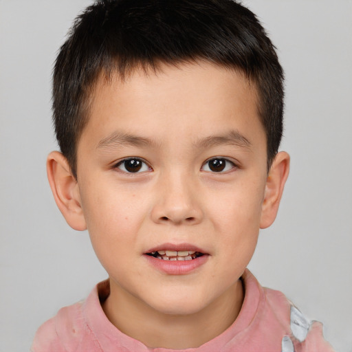 Joyful white child male with short  brown hair and brown eyes
