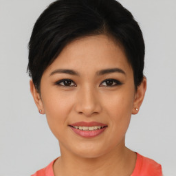 Joyful asian young-adult female with short  black hair and brown eyes