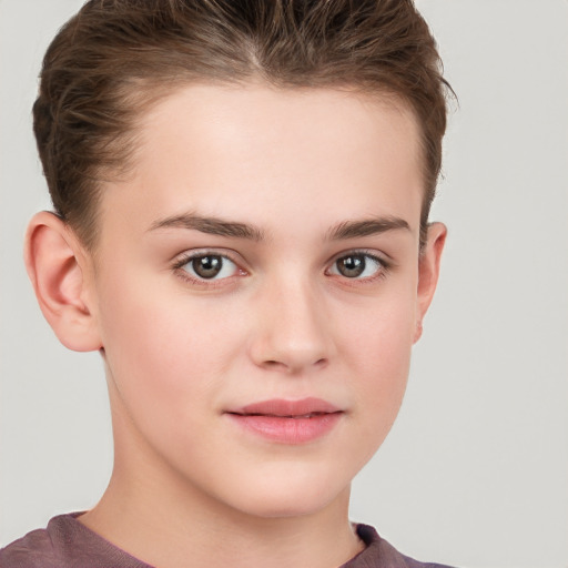 Joyful white child female with short  brown hair and grey eyes