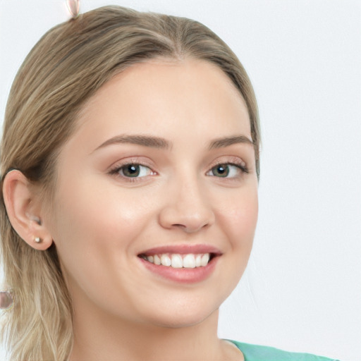 Joyful white young-adult female with long  brown hair and green eyes