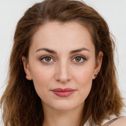 Joyful white young-adult female with long  brown hair and green eyes