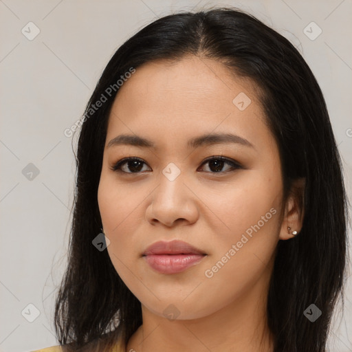 Joyful asian young-adult female with long  brown hair and brown eyes